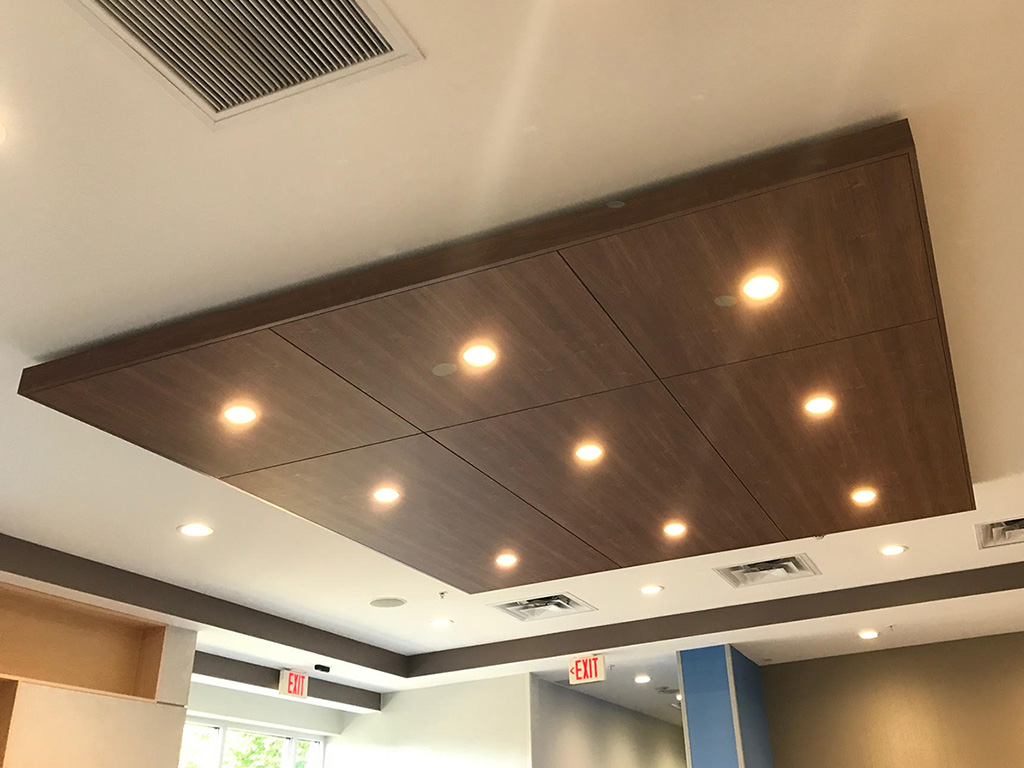 Custom woodwork panels for a grid of 9 ceiling lights at a local restaurant.